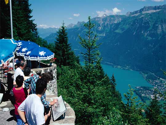  Tourists looking over Brienze Lake, from high balcony of Harder Klum restaurant