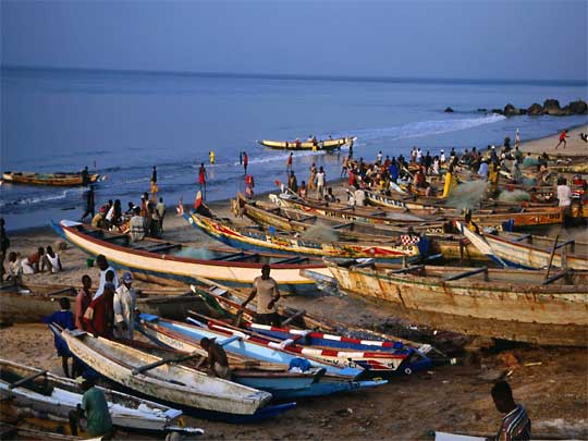  Fishing pirogues lined up on Bakau beach at twilight