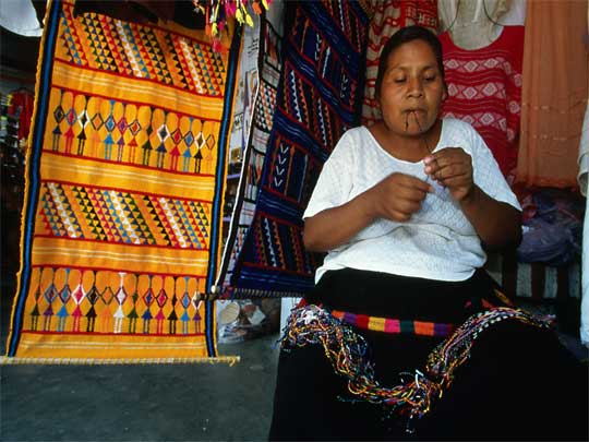  Local vendor selling handmade textiles in La Crucecita