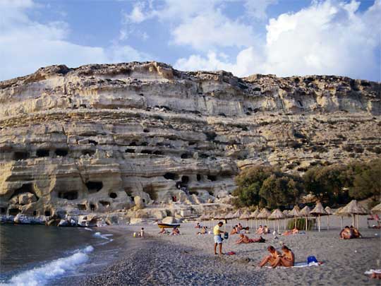  View of beach and caves, once Roman tombs, at Matala
