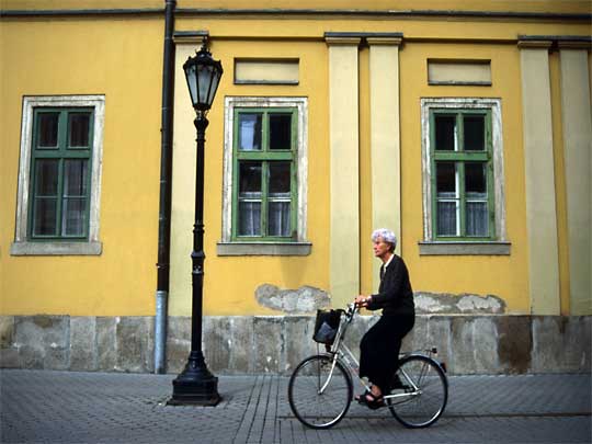  Cycling cobble stoned Szechenyi utca in Eger