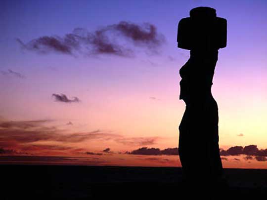  Silhouette of an ancient moai statue at Ahu Ko Te Riku at sunset, Easter Island 