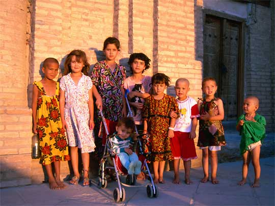  Kids and kitten on street in Tashkent, capital of Uzbekistan