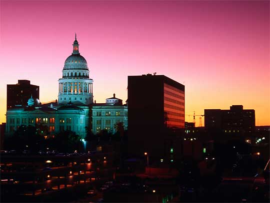  View of city at sunset with Texas State Capitol Building in background