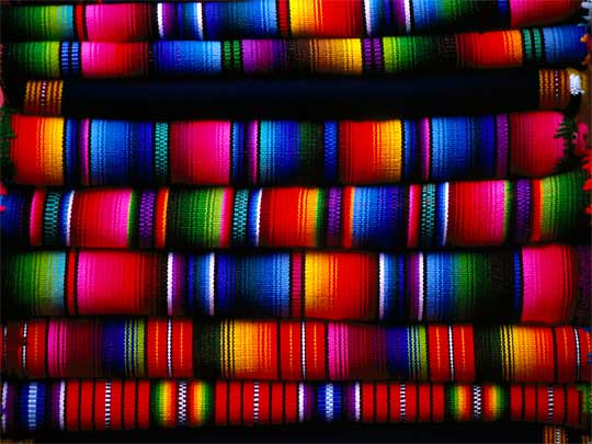  Enough to give you technicolor dreams: pile of folded blankets, Chichicastenango