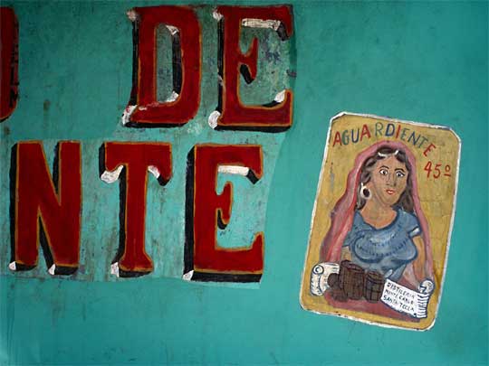 Portrait of worried barmaid at aguardiente liquor shop, Puerto la Libertad 