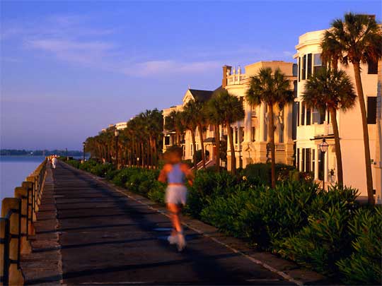  Female jogger, working it, on Battery Seawall, Charleston Harbor