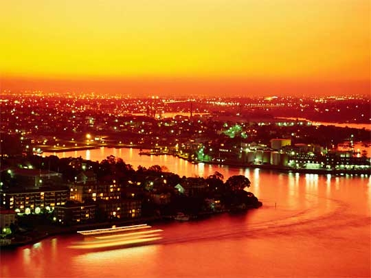  Sunset over Sydney Harbour, with orange and gold highlights from volcanic dust