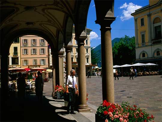 Arched passageway and pedestrians on Piazza della Riforma