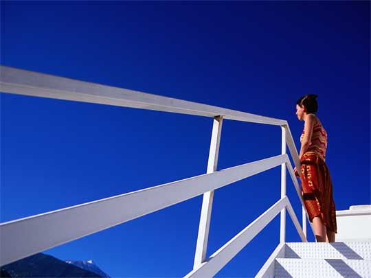  Woman looking at El Teide from staircase