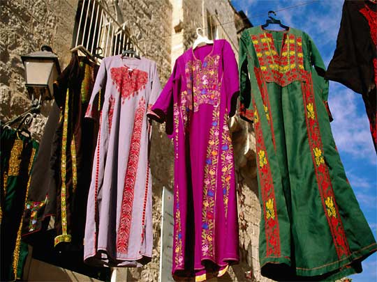  Multi-coloured clothing out to air in the market