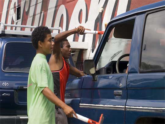  Yes, they're everywhere, including Managua: car window washers at work