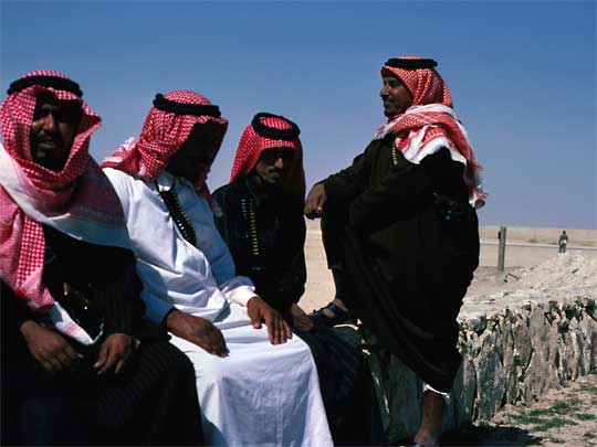  Bedouin men, wearing shamagh headcloths held by agal ropes  