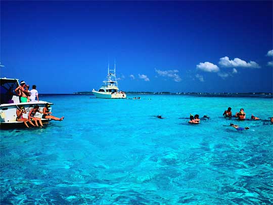  Pleasure boats on sparkling turquoise waters, off Grand Cayman Island