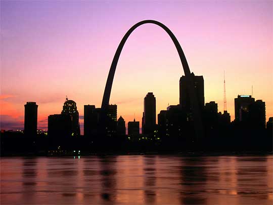  View at sunset over Mississippi River towards downtown and Gateway Arch