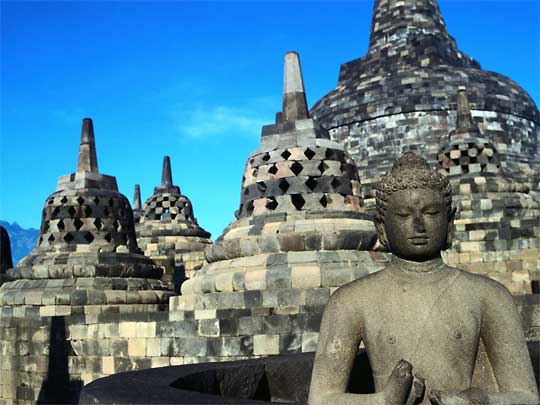  Buddha on top of enormous Borobudur Temple, built between 750 and 850 AD