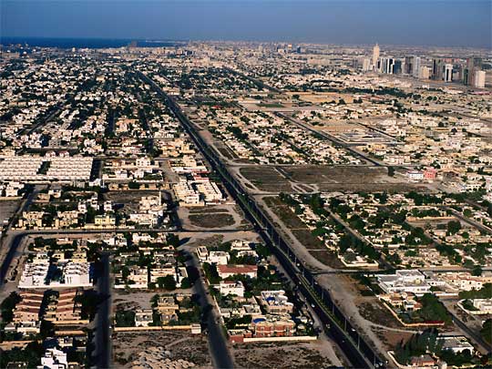  Aerial view of Dubai, with Abu Dhabi Highway through its middle
