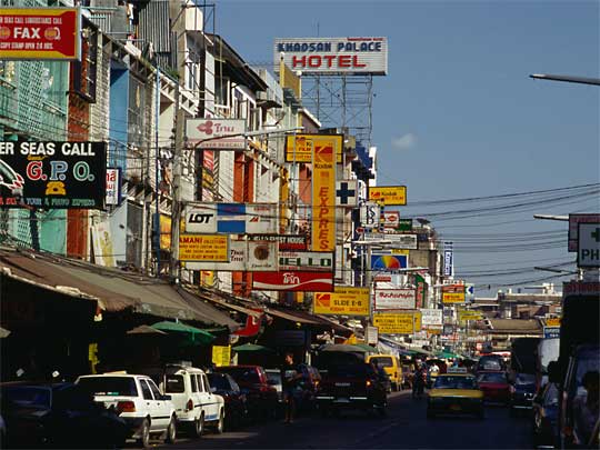 Forest of signs and stream of traffic on Khao San Road