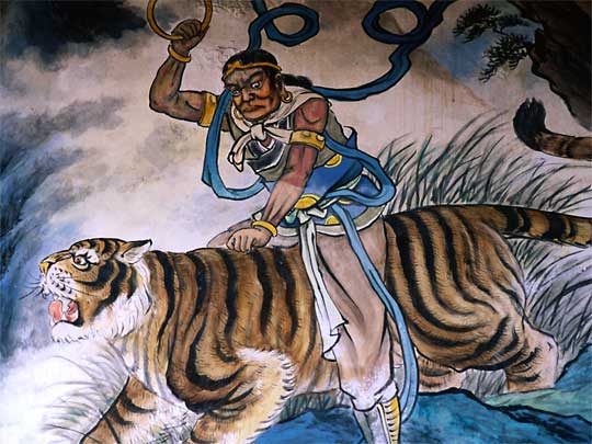  An arresting wall mural, showing a man riding a tiger, at Matsu temple