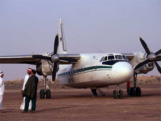  Passengers and Russian-bought Air Mali plane, on runway at Goundam airport
