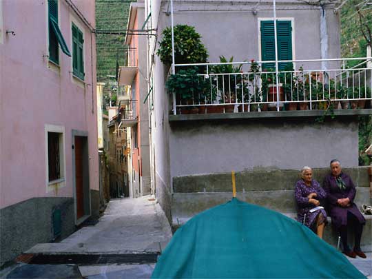  Two elderly women, looking at photographer, in village of Corniglia