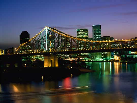  View of city at dusk, with Brisbane River and Story Bridge in foreground