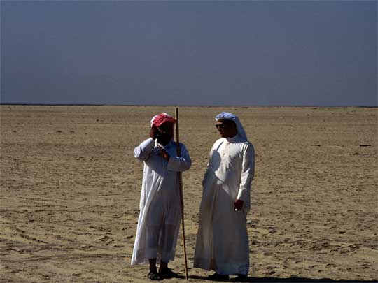  Arab gentlemen in desert, having just discovered more oil