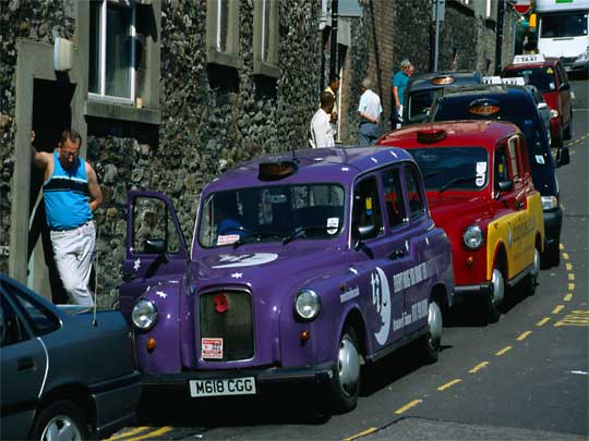  Colourful cabs line up in front of the Bristol bus station