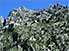 Camouflaged church set in Kotor's barren rock landscape