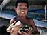 Gilbertese boy with piebald piglet, Tarawa Atoll