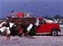 Truck full of freshly caught fish needs a helping hand out of Esmeraldas sand