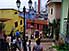 Pedestrians climbing stairs in colorful Las Peñas district