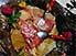 : fish, crab, fruit and vegetables, all cooked in banana leaves