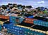 Disco colours: flats nestled into rock at Disko bay