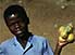Boy with small bag of oranges in town of Gobabis, near Botswanan border