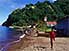Boy runs at photographer in fishing village of Soufriere, South Coast