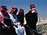 Bedouin men, wearing  headcloths held by  ropes