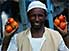 Market seller displaying tomatoes, Khartoum