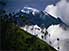 Snow-capped Volcán Tungurahua cushioned by clouds
