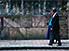 Elderly couple stroll past masonry work of Catedral de la Inmaculada Concepción