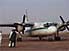 Passengers and Russian-bought Air Mali plane, on runway at Goundam airport