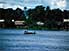 Crowded pirogue ferries passengers across the Banalia River