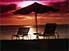 Deep orange magenta sunset over beach and North Pacific Sea