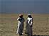 Arab gentlemen in desert, having just discovered more oil