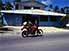 Nauru restaurant and some passersby on a motorbike.