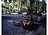 Woman fixing lunch on one of islands of Likiep Atoll