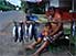 Fisherman, son and fish, outside Pape'ete, Tahiti Nui