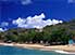 Man, dog and boats on beach at Mayreau Island, one of Grenadine Islands